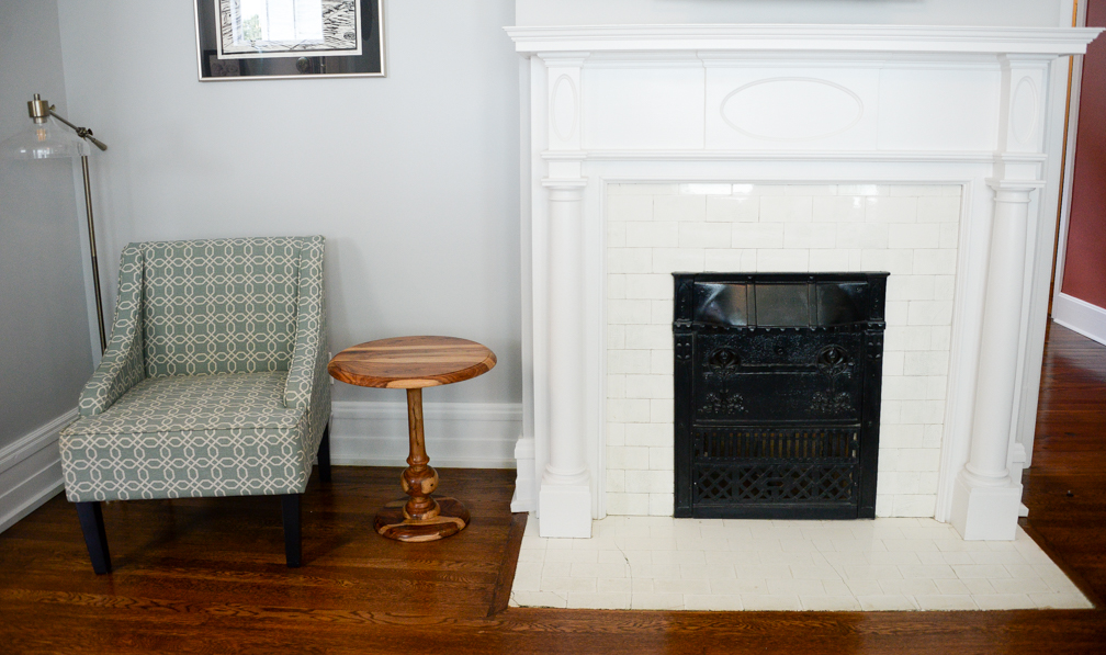 Original fireplace looking amazing with new paint and refinished flooring - Cohlmeyer Construction